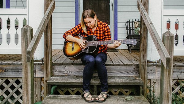 Elizabeth Jayne Henderson on a porch.