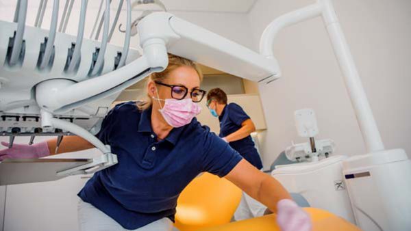 Two female dentist assistants working during their daily duties in a dental surgery
