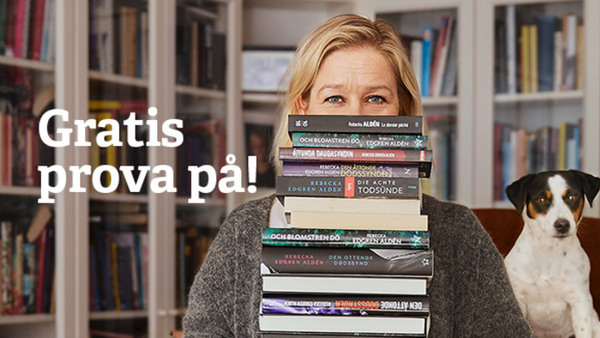 Kvinna med en trave böcker.