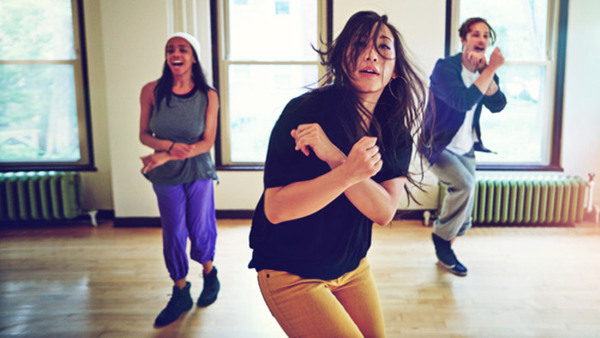 Shot of a group of young people dancing together in a studio