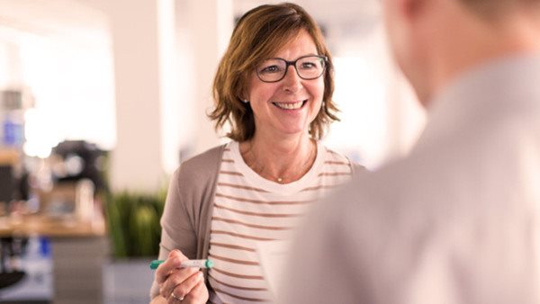 Woman boss speaking to a colleague