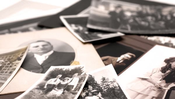 Closeup of a pile of vintage family photos